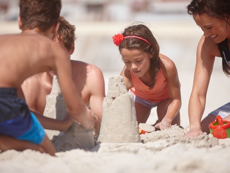 kids building a sandcastle on marco island